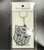 PVC Keychain - Transformers - Autobot Logo - foto real del paquete