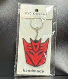 PVC Keychain - Transformers - Decepticon Logo - foto real del paquete