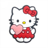 Crocs Charm - Hello Kitty - In Red Overalls Holding Heart