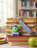 3D PVC Figure Keychain - Monsters, Inc. - Mike Wazowski On Books With Purple Strap
