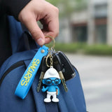 3D PVC Figure Keychain - Los Pitufos Pitufo Filósofo - Brainy Smurf Book Thumbs Up
