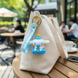 3D PVC Figure Keychain - Cinnamoroll De Hello Kitty - Cinnamoroll Blue Dress Holding Bear