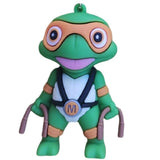 3D PVC Figure Keychain - Las Tortugas Ninja - Michelangelo Holding Nunchaku