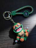 3D PVC Figure Keychain - Las Tortugas Ninja - Chibi Michelangelo Happy Nunchaku