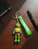 3D PVC Figure Keychain - Las Tortugas Ninja - Michelangelo Holding Nunchaku Variant 2