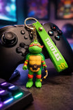 3D PVC Figure Keychain - Las Tortugas Ninja - Michelangelo Holding Nunchaku Variant 2