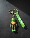 3D PVC Figure Keychain - Las Tortugas Ninja - Raphael Holding Sai