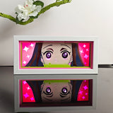 Demon Slayer Nezuko Kamado peeking with bamboo gag anime light box — lit, front view