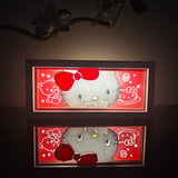 Hello Kitty peeking with red bow anime light box — dark room atmospheric