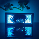 Demon Slayer Giyu Tomioka with glowing blue eyes anime light box — dark room atmospheric