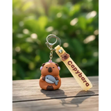 3D PVC Figure Keychain - Capybara - With Headphones Holding Fish