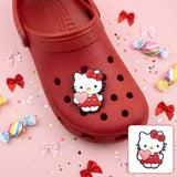 Crocs Charm - Hello Kitty - In Red Overalls Holding Heart