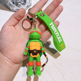 3D PVC Figure Keychain - Las Tortugas Ninja - Michelangelo Holding Nunchaku Variant 2