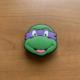 Crocs Charm - Teenage Mutant Ninja Turtles - Donatello's Head With Purple Mask