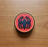 Crocs Charm - Spider-Man - Round Black Spider Logo On Red